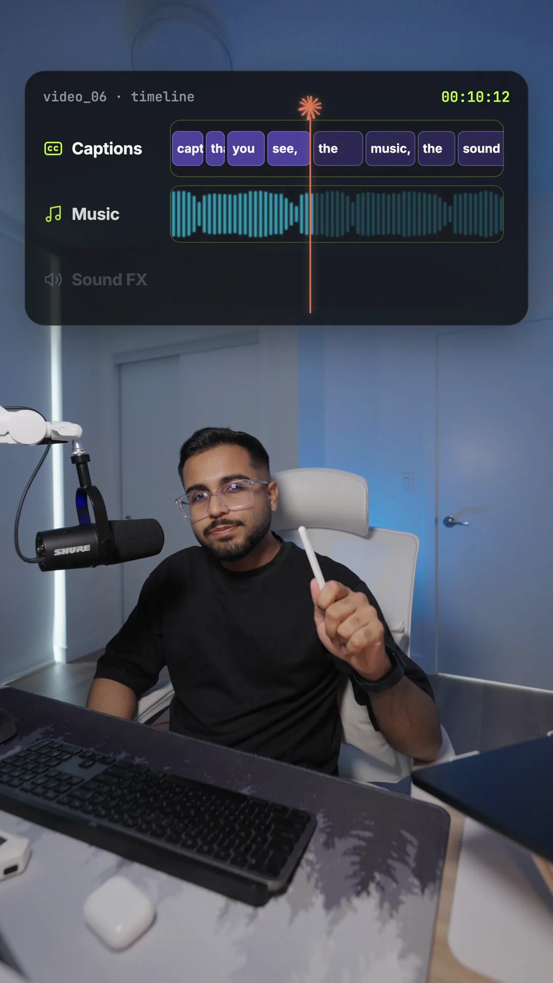 A timeline panel above Ishan's head showing caption clips, a music waveform and a sound effects track, with a caption under his chin